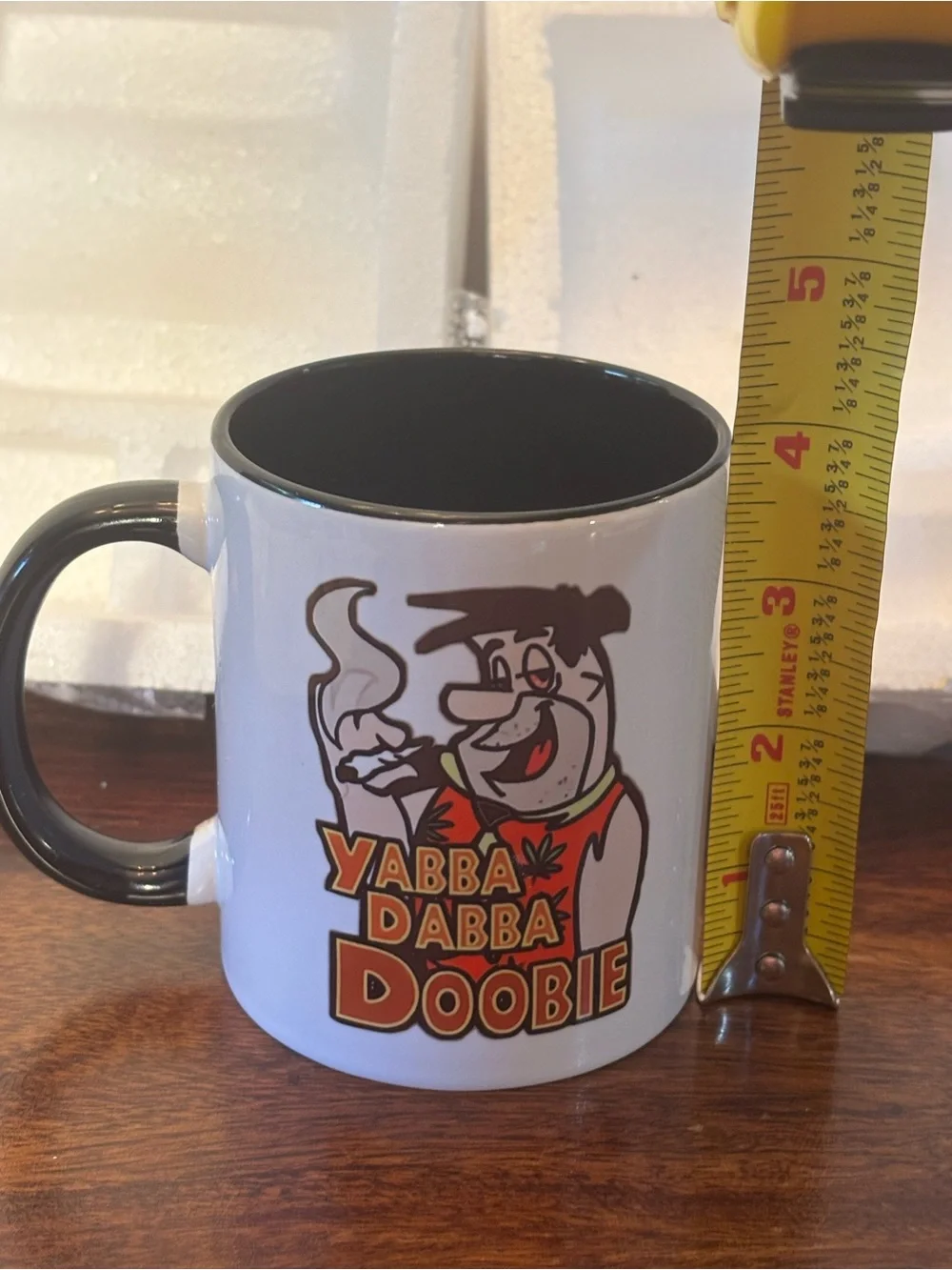 Novelty White Ceramic Coffee Mug with Black Handle - Yabba Dabba Doobie Design